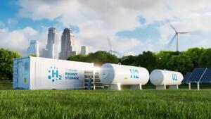 Rendu 3D d'un conteneur blanc marqué « H2 Hydrogen Energy Storage » et de deux réservoirs cylindriques blancs posés sur une pelouse, avec des éoliennes, un panneau solaire et des gratte-ciel en arrière-plan.