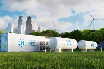 Rendu 3D d'un conteneur blanc marqué « H2 Hydrogen Energy Storage » et de deux réservoirs cylindriques blancs posés sur une pelouse, avec des éoliennes, un panneau solaire et des gratte-ciel en arrière-plan.